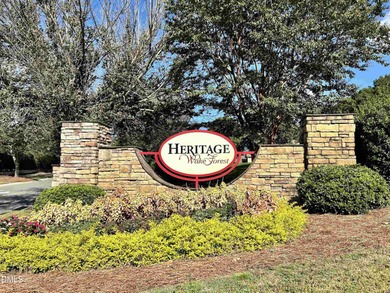 Main Floor Primary & In-Law Suite: Nestled beautifully among the on Heritage Golf Club in North Carolina - for sale on GolfHomes.com, golf home, golf lot