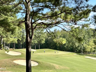Main Floor Primary & In-Law Suite: Nestled beautifully among the on Heritage Golf Club in North Carolina - for sale on GolfHomes.com, golf home, golf lot