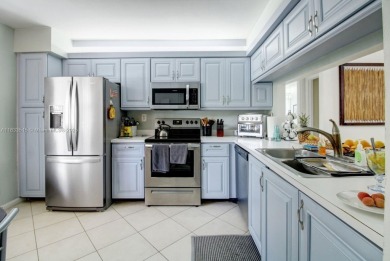 Welcome to this beautifully maintained first-floor corner unit on Sunrise Lakes Phase IV Golf Course in Florida - for sale on GolfHomes.com, golf home, golf lot