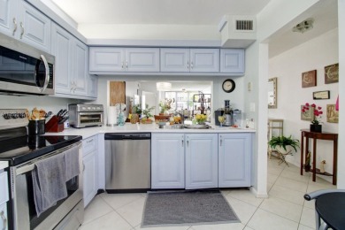 Welcome to this beautifully maintained first-floor corner unit on Sunrise Lakes Phase IV Golf Course in Florida - for sale on GolfHomes.com, golf home, golf lot