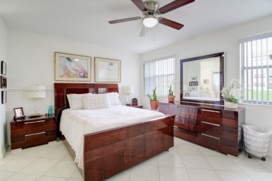 Welcome to this beautifully maintained first-floor corner unit on Sunrise Lakes Phase IV Golf Course in Florida - for sale on GolfHomes.com, golf home, golf lot