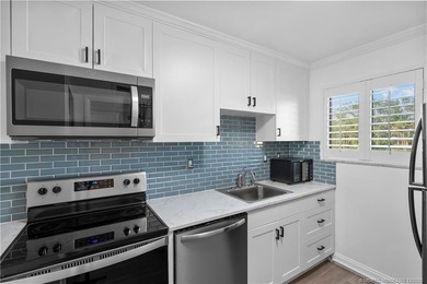 Fully renovated with quality finishes, this light and bright 1 on Miles Grant Country Club in Florida - for sale on GolfHomes.com, golf home, golf lot