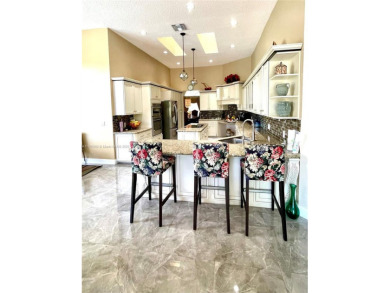 Located behind the prestigious guard-gated entrances of Eagle on TPC Eagle Trace in Florida - for sale on GolfHomes.com, golf home, golf lot