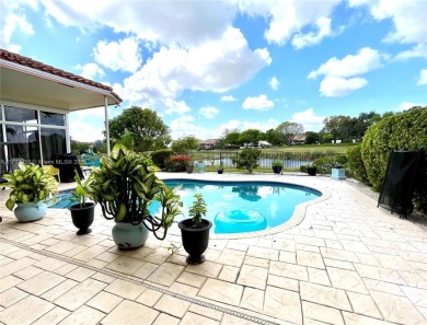 Located behind the prestigious guard-gated entrances of Eagle on TPC Eagle Trace in Florida - for sale on GolfHomes.com, golf home, golf lot