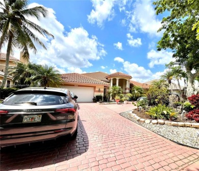 Located behind the prestigious guard-gated entrances of Eagle on TPC Eagle Trace in Florida - for sale on GolfHomes.com, golf home, golf lot