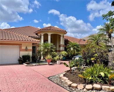 Located behind the prestigious guard-gated entrances of Eagle on TPC Eagle Trace in Florida - for sale on GolfHomes.com, golf home, golf lot