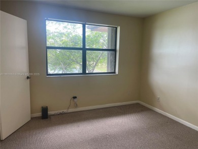 Discover serene living in this charming 2 bed, 2 bath condo on Pembroke Lakes Golf Club in Florida - for sale on GolfHomes.com, golf home, golf lot
