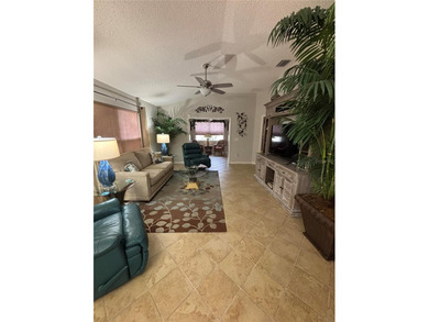This home is in a desirable area and features an extra room off on Bacall Executive Golf Course in Florida - for sale on GolfHomes.com, golf home, golf lot