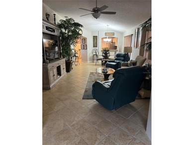 This home is in a desirable area and features an extra room off on Bacall Executive Golf Course in Florida - for sale on GolfHomes.com, golf home, golf lot