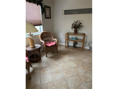 This home is in a desirable area and features an extra room off on Bacall Executive Golf Course in Florida - for sale on GolfHomes.com, golf home, golf lot