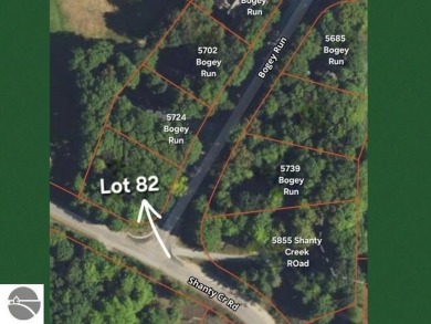 This is an easy to find property on the corner of Bogey Run and on Shanty Creek Golf Course in Michigan - for sale on GolfHomes.com, golf home, golf lot
