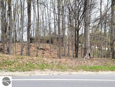 This is an easy to find property on the corner of Bogey Run and on Shanty Creek Golf Course in Michigan - for sale on GolfHomes.com, golf home, golf lot