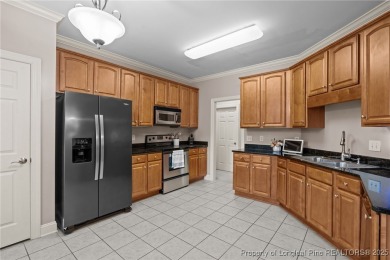 The best of both worlds! Family time downstairs & a bonus room on Anderson Creek Golf Club in North Carolina - for sale on GolfHomes.com, golf home, golf lot