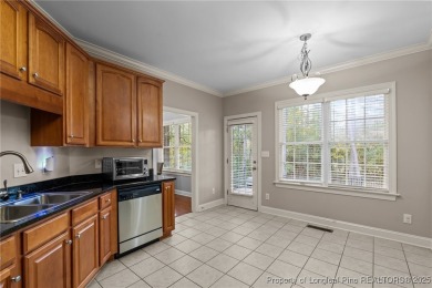 The best of both worlds! Family time downstairs & a bonus room on Anderson Creek Golf Club in North Carolina - for sale on GolfHomes.com, golf home, golf lot