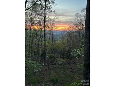 Wake up each day to breathtaking long-range mountain views and on High Vista Country Club in North Carolina - for sale on GolfHomes.com, golf home, golf lot