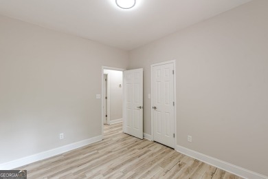 Freshly Renovated 3 Bedroom/2 Bathroom Home perched up high on 2 on Lake Spivey Golf Club in Georgia - for sale on GolfHomes.com, golf home, golf lot