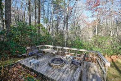 You'll feel charmed by this three-bedroom, two-bath home on Sapphire National Golf Club in North Carolina - for sale on GolfHomes.com, golf home, golf lot
