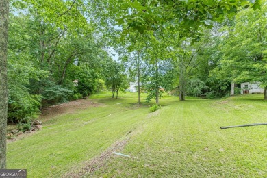 Freshly Renovated 3 Bedroom/2 Bathroom Home perched up high on 2 on Lake Spivey Golf Club in Georgia - for sale on GolfHomes.com, golf home, golf lot