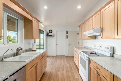 Welcome to this move-in ready 2 bedroom, 2 bath Gemini home on Sun City Country Club in Arizona - for sale on GolfHomes.com, golf home, golf lot