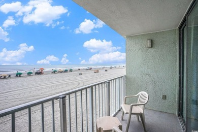 This a sun-filled, 2-bedroom, 2-bath oceanfront condo located on on The Dunes Golf and Beach Club in South Carolina - for sale on GolfHomes.com, golf home, golf lot
