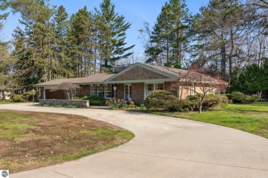 Mid-century modern classic, designed by renowned Charlevoix on Charlevoix Golf Club in Michigan - for sale on GolfHomes.com, golf home, golf lot