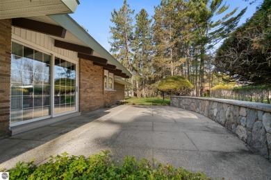 Mid-century modern classic, designed by renowned Charlevoix on Charlevoix Golf Club in Michigan - for sale on GolfHomes.com, golf home, golf lot