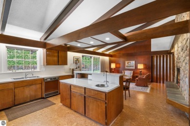 Mid-century modern classic, designed by renowned Charlevoix on Charlevoix Golf Club in Michigan - for sale on GolfHomes.com, golf home, golf lot