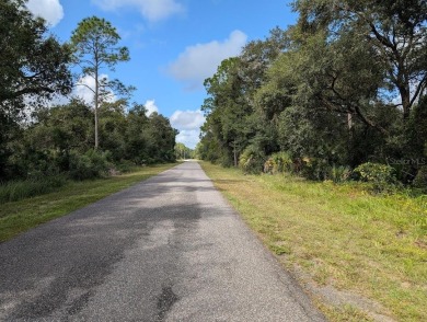 Build your forever home on this beautiful acre property on Indian Lake Estates Golf and Country Club in Florida - for sale on GolfHomes.com, golf home, golf lot