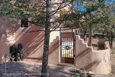 Southwest elegance meets resort living in this Santa Fe style on Alto Lakes Golf and Country Club in New Mexico - for sale on GolfHomes.com, golf home, golf lot