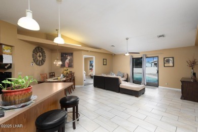 This 3-bedroom, 2-bath pool home is conveniently located in on London Bridge Golf Course in Arizona - for sale on GolfHomes.com, golf home, golf lot