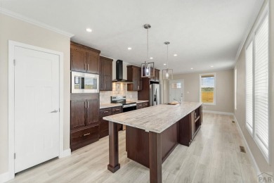 Experience modern country living with breathtaking mountain on Hollydot Golf Course in Colorado - for sale on GolfHomes.com, golf home, golf lot
