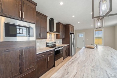 Experience modern country living with breathtaking mountain on Hollydot Golf Course in Colorado - for sale on GolfHomes.com, golf home, golf lot