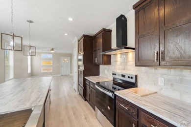 Experience modern country living with breathtaking mountain on Hollydot Golf Course in Colorado - for sale on GolfHomes.com, golf home, golf lot