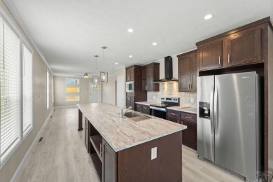 Experience modern country living with breathtaking mountain on Hollydot Golf Course in Colorado - for sale on GolfHomes.com, golf home, golf lot
