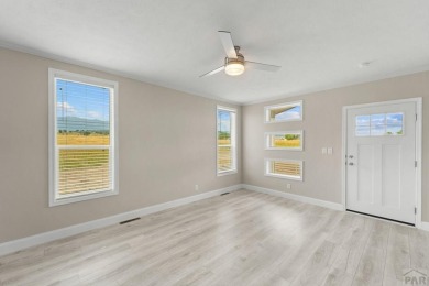 Experience modern country living with breathtaking mountain on Hollydot Golf Course in Colorado - for sale on GolfHomes.com, golf home, golf lot