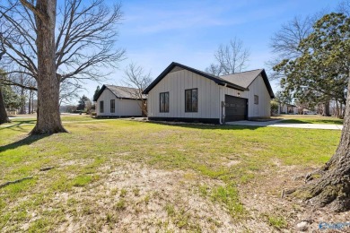 Stylish mid-century modern on a prime corner lot in vibrant on Point Mallard Golf Course in Alabama - for sale on GolfHomes.com, golf home, golf lot