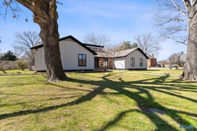 Stylish mid-century modern on a prime corner lot in vibrant on Point Mallard Golf Course in Alabama - for sale on GolfHomes.com, golf home, golf lot