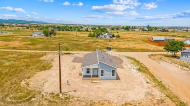 Experience modern country living with breathtaking mountain on Hollydot Golf Course in Colorado - for sale on GolfHomes.com, golf home, golf lot