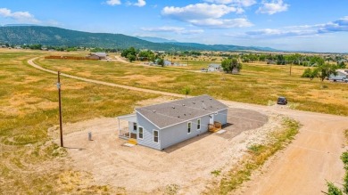 Experience modern country living with breathtaking mountain on Hollydot Golf Course in Colorado - for sale on GolfHomes.com, golf home, golf lot