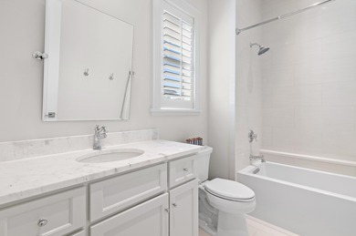 259 Moonlit Way is an exceptional Southerninspired residence on Regatta Bay Golf and Country Club in Florida - for sale on GolfHomes.com, golf home, golf lot