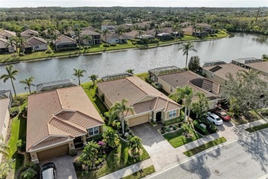 This exquisite residence within River Strand Golf and Country on River Strand Golf and Country Club At Heritage Harbour  in Florida - for sale on GolfHomes.com, golf home, golf lot