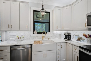 Welcome to your Florida dream home, beautifully positioned on a on Sabal Trace Golf and Country Club in Florida - for sale on GolfHomes.com, golf home, golf lot