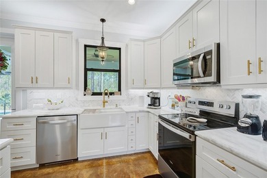 Welcome to your Florida dream home, beautifully positioned on a on Sabal Trace Golf and Country Club in Florida - for sale on GolfHomes.com, golf home, golf lot