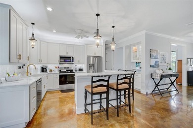 Welcome to your Florida dream home, beautifully positioned on a on Sabal Trace Golf and Country Club in Florida - for sale on GolfHomes.com, golf home, golf lot