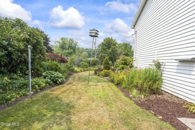 Expansive perennial gardens create a scenic park-like setting on Schuyler Meadows Club in New York - for sale on GolfHomes.com, golf home, golf lot