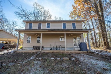 Nestled on a serene wooded lot in the Diamondhead community on Diamondhead Golf and Country Club in Arkansas - for sale on GolfHomes.com, golf home, golf lot