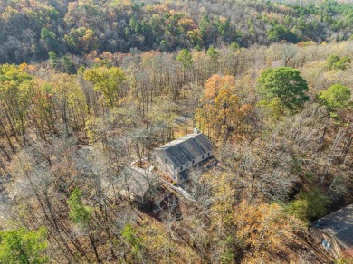 Nestled on a serene wooded lot in the Diamondhead community on Diamondhead Golf and Country Club in Arkansas - for sale on GolfHomes.com, golf home, golf lot