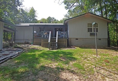 HOME WITH LARGE SHOP AND PRIVACY!  1,492 square foot home great on Cherokee Village North Course in Arkansas - for sale on GolfHomes.com, golf home, golf lot
