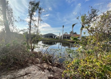 Oversized lot on a very large canal with a beautiful western on Coral Oaks Golf Course in Florida - for sale on GolfHomes.com, golf home, golf lot