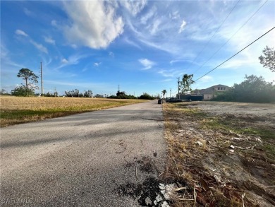 Oversized lot on a very large canal with a beautiful western on Coral Oaks Golf Course in Florida - for sale on GolfHomes.com, golf home, golf lot